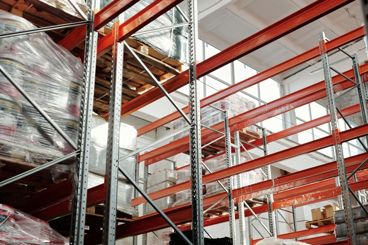Organized warehouse aisles with palletized goods on industrial storage racks